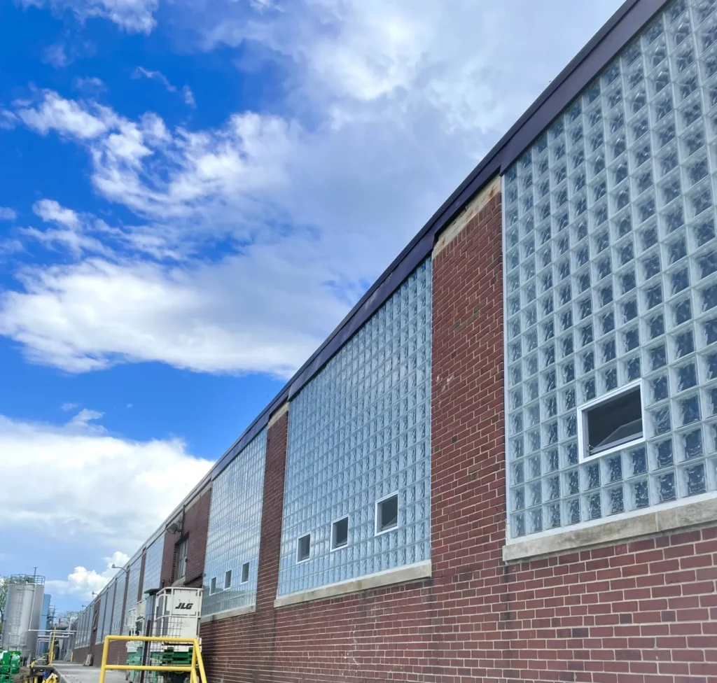 Vented glass block windows along brick warehouse exterior