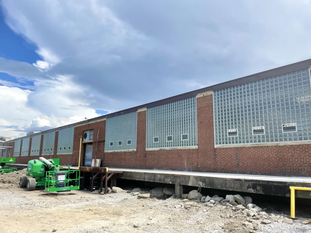 New glass block windows spanning a brick warehouse exterior