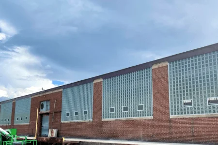Polymer factory after large glass block window installation