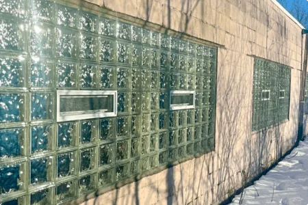 Pool company warehouse after large glass block window installation